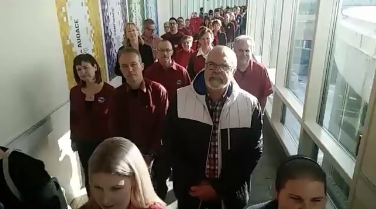 Group of people walking in a hallway