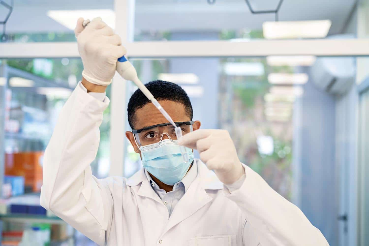 Medical lab professional wearing a mask