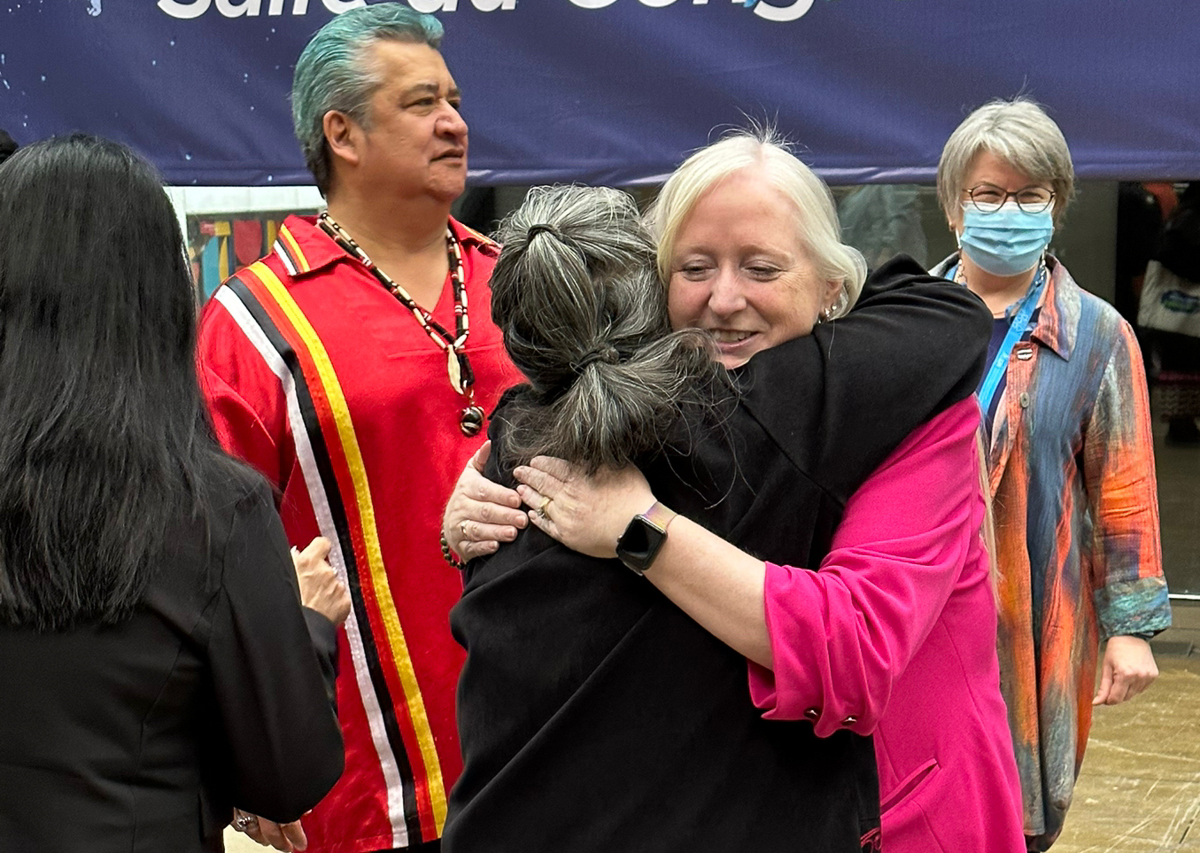 OPSEU/SEFPO FVPT Laurie Nancekivell embraces Indigenous Circle Chair Tina Stevens before the opening of Convention 2023.